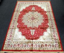 RED GROUND KASHMIR CARPET floral medallion design, 232 x 325cms