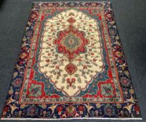 TABRIZ CARPET multi-coloured ground with unique medallion design, 215 x 315cms