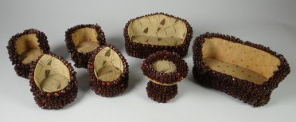 A PARCEL OF 'COFFEE BEAN' DOLL'S HOUSE FURNITURE with two sofas, four chairs and a circular