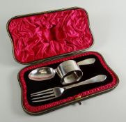 A SILVER CHRISTENING CUTLERY SET comprising spoon, fork and napkin ring, London 1905, 23ozs