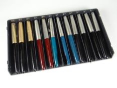 TWELVE VINTAGE PARKER 51 FOUNTAIN PENS including 3 x black with rolled gold caps, 4 x black with