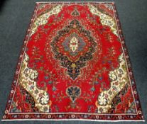 PERSIAN TABRIZ CARPET multi-coloured medallion design, 226 x 315cms