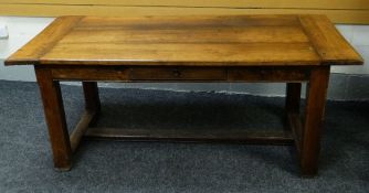A JOINED OAK REFECTORY TABLE with single centre drawer and low stretcher, believed nineteenth