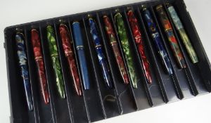 TRAY OF TWELVE VINTAGE CONWAY STEWART 'DINKIE' MARBLED FOUNTAIN PENS