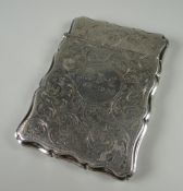A SILVER CALLING CARD CASE with profuse foliate engraving and 1887-1908 dated monogram, Birmingham