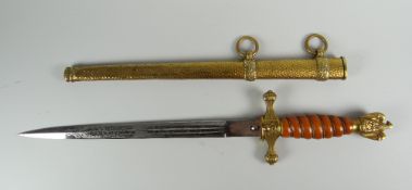 A GERMAN KRIEGSMARINE DAGGER with beaten effect yellow metal scabbard, yellow metal finial and