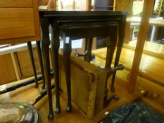 Set of three reproduction mahogany tables and a small upholstered footstool