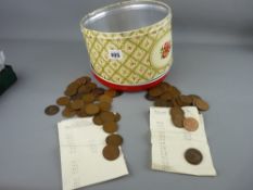 Vintage tin containing a quantity of bronze coinage