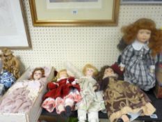 Quantity of porcelain headed dolls, some on stands and boxed