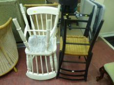Pair of white painted stickback chairs and a pair of similar black and basket weave chairs