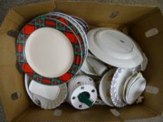 Box with assortment of decorative and dinnerware plates
