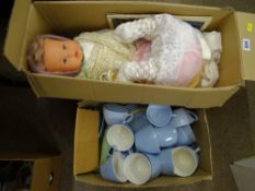 Box of dolls and plastic dinnerware