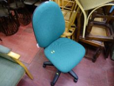 Green upholstered office chair on a swivel base
