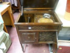 Polished gramophone cabinet with gramophone contents