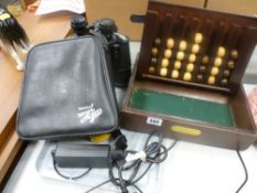 Remy Martin Cognac board game and a cased set of binoculars