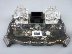 Mother of pearl inlaid papier mache deskstand with two glass ink bottles