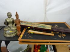 Pair of Siamese straw pictures, large fan, another fan and Eastern figurines etc