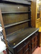 Dark wood Priory style dresser with two drawers and two base cupboards