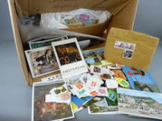 Large box of unsorted stamps and cards