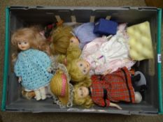 Crate of porcelain headed dolls on stands and similar