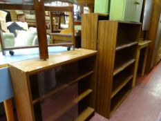 Three mahogany effect bookcases, one with glazed sliding doors