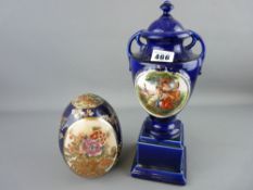 Classically styled pottery urn on stand and a Satsuma decorated pottery egg