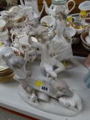 Two Lladro bisque child figures together with a Nao bisque figure