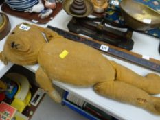 A vintage straw stuffed teddy with one eye