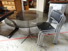 Circular black glass table & four chrome framed chairs