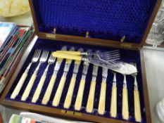 A cased set of fish knives, forks & servers