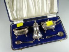 A silver cased cruet set