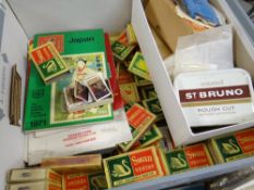 A box containing numerous Swan Vesta match boxes, each containing stamps with detailed studies of