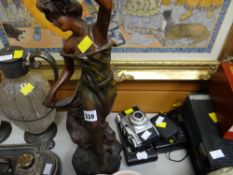 A spelter figure of a female, three vintage cameras