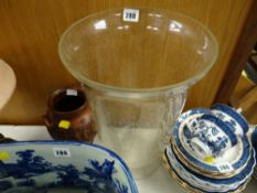 A large clear glass vase together with a decorated twin-handled vase