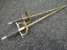 A pair of decorative fencing swords