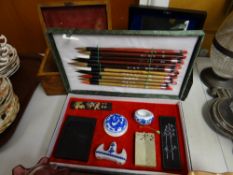 A Chinese cased artist's painting box, small inlaid tea caddy & another decorated box