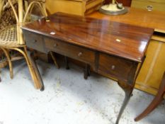 A small mahogany desk with cabriole legs