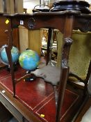 A mahogany shaped top occasional table with lower shelf