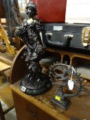 A bronze effect figure together with a bronze dancing Hindu God figure