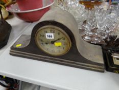 A dome top mantel clock