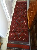 A blue & red pattern Meshwani runner, 238 x 59cms