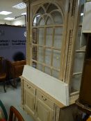 A modern limed oak glass top display cabinet, two-drawer & two cupboard base, 214 x 130 x 50cms