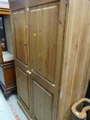 A two-door pine wardrobe