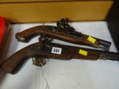 Two reproduction flintlock pistols