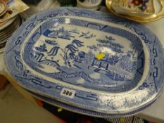 Two blue & white willow patterned chargers