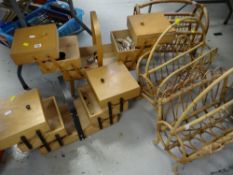 A pair of wooden sewing boxes with contents together with three wicker magazine racks