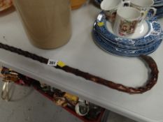 A hallmarked silver-handled Briar Wood walking cane