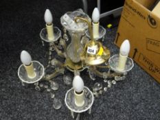 A modern brass & glass five-branch chandelier