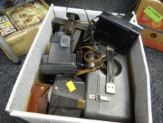 A box of vintage cameras, photographic equipment etc