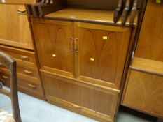 G-Plan style cabinet with two doors above a long drawer